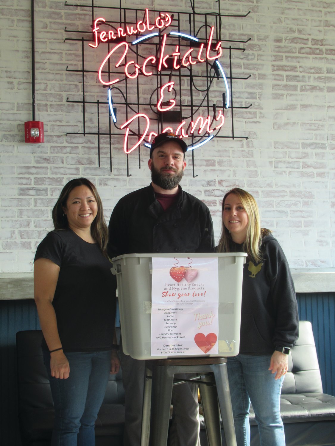 CHEF’S CORNER: Talented chef Justin Ferreira is joined by The Coop owners Meliza Ferruolo (left) and Tonya Antonelli after discussing such specials as loaded fries with Mozambique sauce, fried cauliflower bites and different wing sauces that are served seven days a week.
